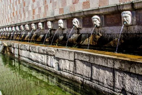 Fountain of the 99 Spouts ( Fontana delle 99 cannelle), L Aquila, Italy Stock Photos