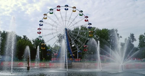 Fountain and ferris wheel in The A. Pushkin Park of Culture and Leisure Stock Footage 90608402
