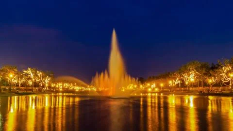 Fountain and reflection of light effects at night, park in Bangkok, Thailand. Stock Photos