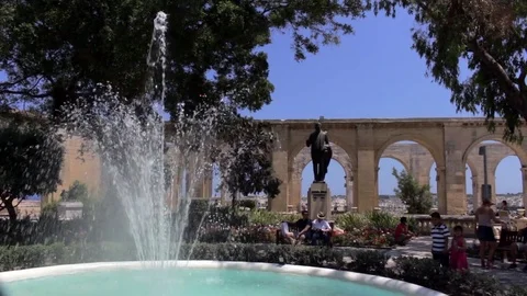 Fountain and statue in front of decorative arches Stock Footage 84717532