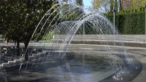 Fountain Arch. Jets of water fall on stones in sparkling arc.City Park Krasnodar Stock Footage 141576445