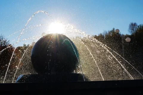 Fountain in the background of the sun Stock Photos