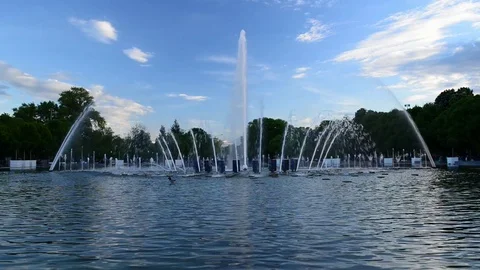 Fountain on blue cloudy sky background Видео 81183725