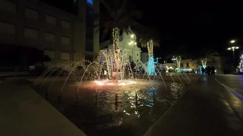 Fountain in central square at Ispica, Sicily by night slow-motion Stock-Footage 296588653