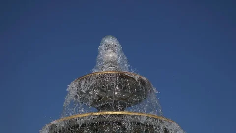 Fountain classical form in three round bowls with cascade jets in city park. Stock Footage 112940971