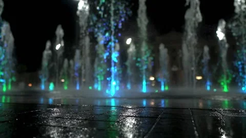 Fountain in dark. A view of nice multicolor fountain in night city. Stock Footage 139815453