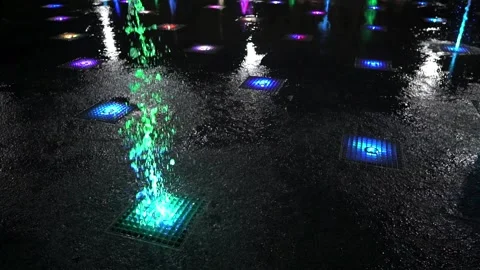 Fountain in dark. A view of nice multicolor fountain in night city. Stock Footage 139815566