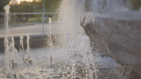 Fountain with decorative stones in the park, close-up of the water jets of the Stock Footage 147731153