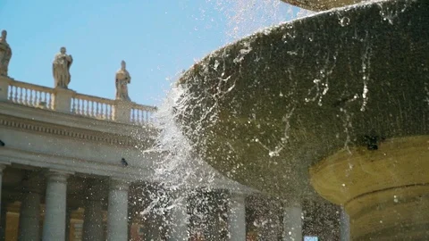 Fountain at the dome of the Basilica of St. Peter. Vatican City. Slow mo camera Stock Footage 107838718