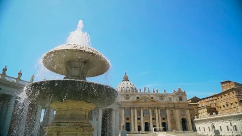 Fountain at the dome of the Basilica of St. Peter. Vatican City. Slow mo camera Stock Footage 107839631