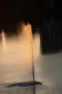 Fountain fire effect by lake Stock Photos
