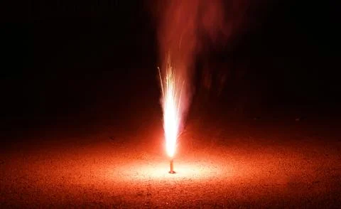 Fountain firework stream into dark night Stock Photos