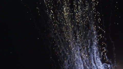 Fountain fireworks raining down in sparks against multicolored smoke Stock Footage 59516942