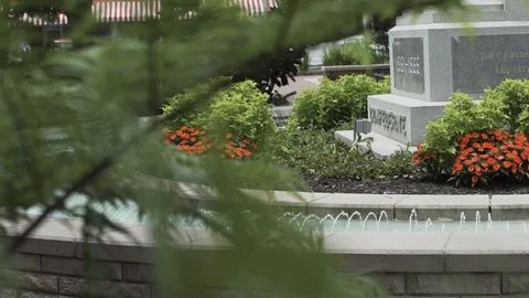 A Fountain Flows In A Small Town Square Stock Footage 87476686