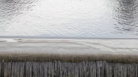 Fountain in form of a waterfall on a cloudy day Stock Footage 122471780