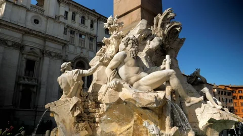 Fountain of four rivers, located on Piazza Navona that depicts gods Stock Footage 144678139