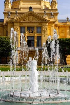 Fountain in front of old building Stock Photos