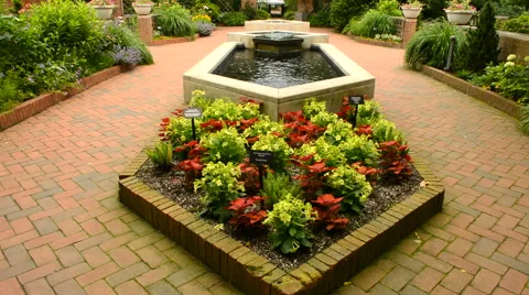 Fountain in a garden setting Stock Footage 51681374