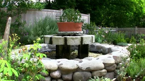 Fountain in herb garden Stock Footage 12249870