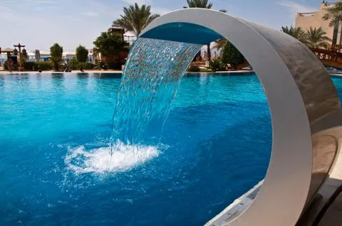 Fountain at hotel pool Stock Photos