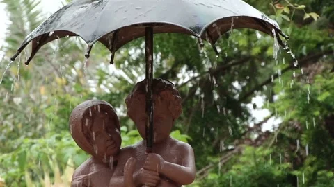 Fountain if two children under an umbrella, Cadiz Stock Footage 72695409