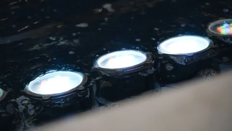 Fountain illumination in close-up. The lights are in the water. Beautiful light. Stock Footage 122774878