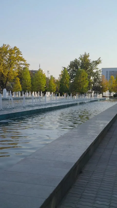 Fountain at Independence Square surrounded by buildings in central Tashkent Stock Footage 318635267