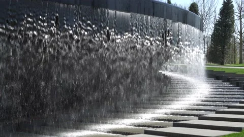 Fountain "Infinity". Water falls in streams into granite bed of artificial river Stock Footage 153972397