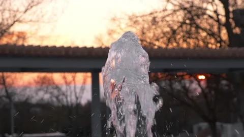 Fountain jet at sunset, close-up Video stock 334856391
