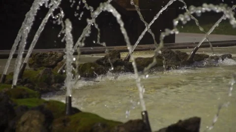 Fountain jets  on a rocky background Vidéo 49198920