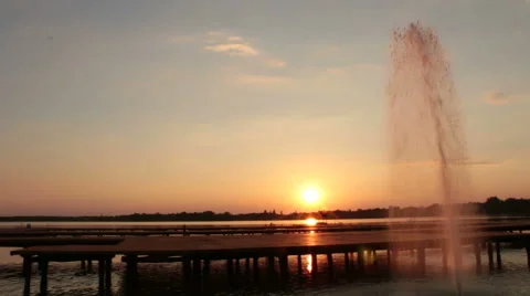 Fountain in the lake at sunset Stock Footage 44414313