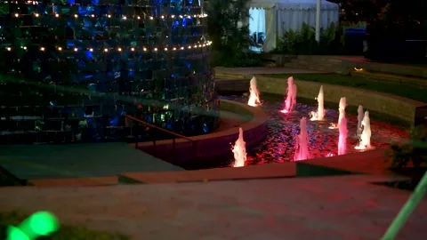 A Fountain That Lights up at Night Stock Footage 244761884