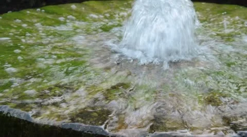 Fountain made of an old millstone Stock Footage 16738665