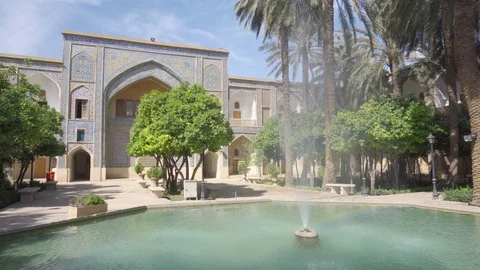 Fountain in middle of courtyard of Madrasa e-Khan, Shiraz, Iran Stock Footage 100656955