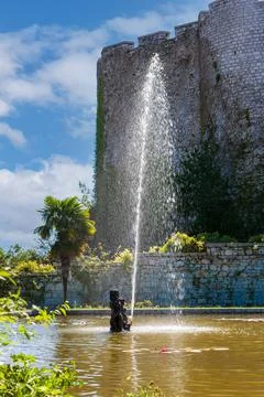Fountain near the Gothic Duino Castle on a cliff above the Gulf of Trieste (A Stock Photos