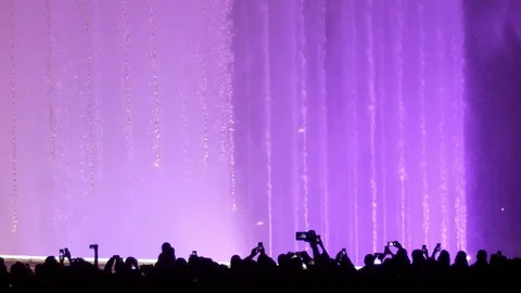 Fountain of Olympic Park Sochi light show night. Slow motion Stock Footage 97433437