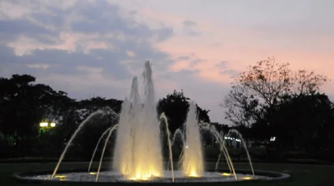 Fountain in the park at sunset Stock Footage 33473668