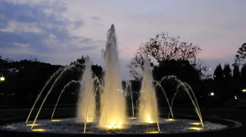 Fountain in the park at sunset Stock Footage 33495639