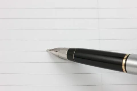 Fountain pen and notepad Stock Photos