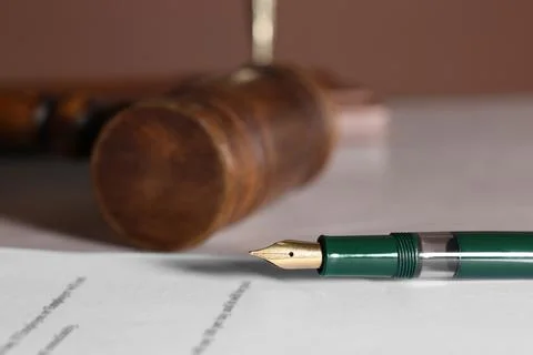 Fountain pen and paper document on table, closeup with space for text. Nota.. Stock Photos