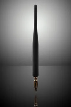 Fountain pen on dark background with gradient Stock Photos