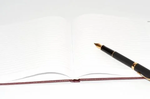Fountain pen on the notepad Stock Photos