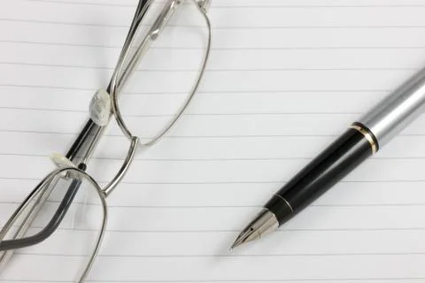 Fountain pen,notepad &amp; glasses Stock Photos