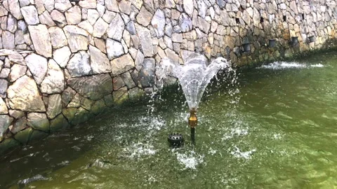 Fountain in the pond made of stone Stock Footage 154946185