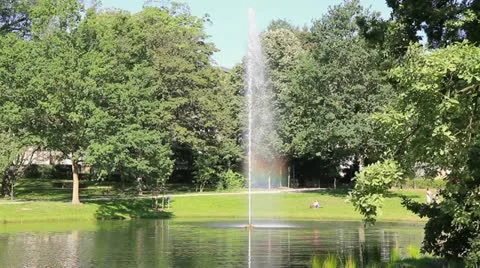 Fountain with rainbow in the park Stock Footage