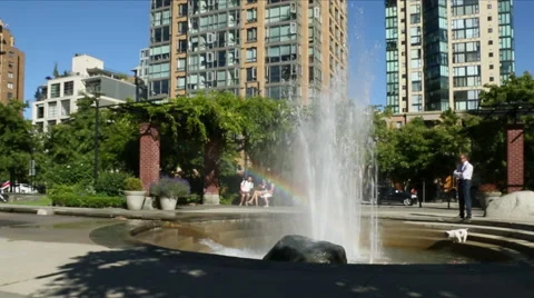Fountain with a rainbow  in a park Stock Footage 51772774