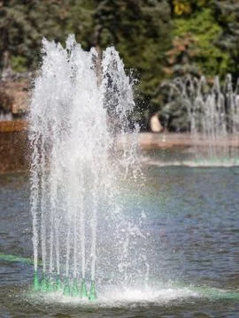 Fountain with a rainbow Stock Photos