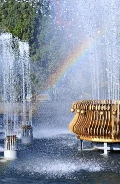 Fountain with rainbow Stock Photos
