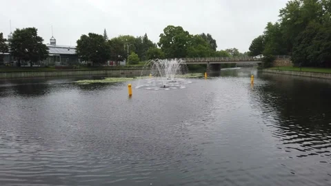 Fountain in a river with lily pads Stock Footage 138373393