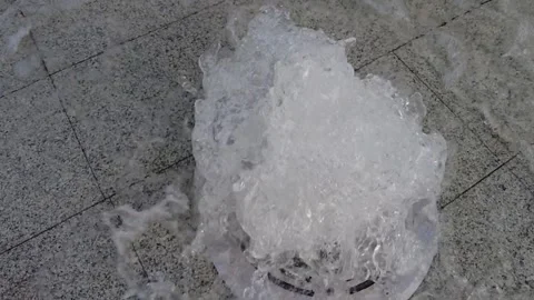 Fountain in slow motion. Stream Water splashes of a embedded source. Stock Footage 159367546